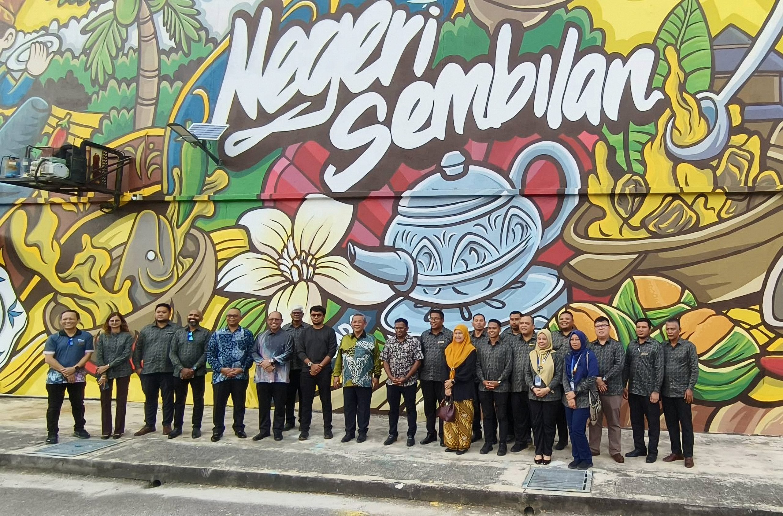 Visitors in front of the Negeri Sembilan mural at PD Waterfront